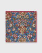 Load image into Gallery viewer, Hand-Rolled Linen/Cotton Print Pocket Square in Blue/Brown Multi Paisley Scene