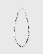 Load image into Gallery viewer, Small Elongated Cowbone Beads Brown/White Zigzag