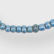 Tiny African Beads in Ocean