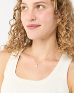 Load image into Gallery viewer, Tiny Ceramic Egg Pendant Necklace in Cream/Gold
