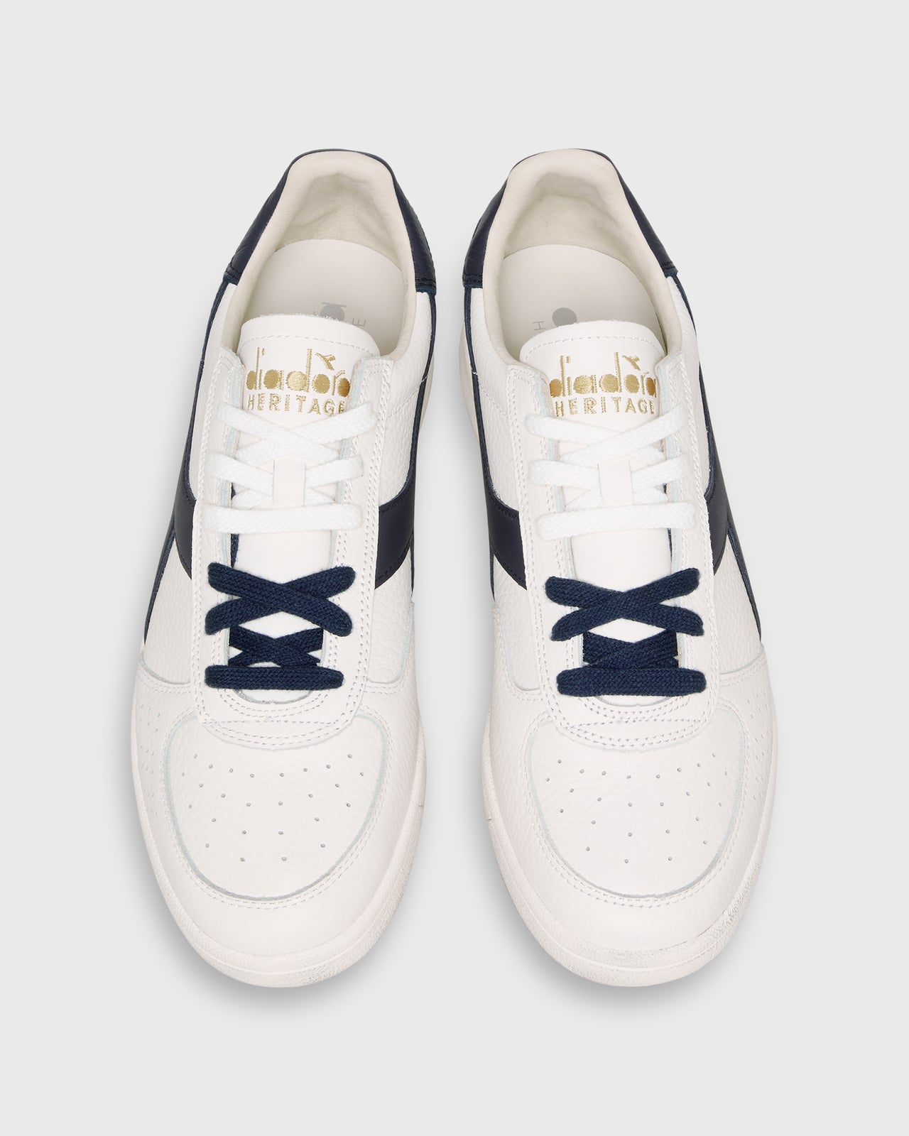 B. Elite Dominio Sneaker in White/Peacoat
