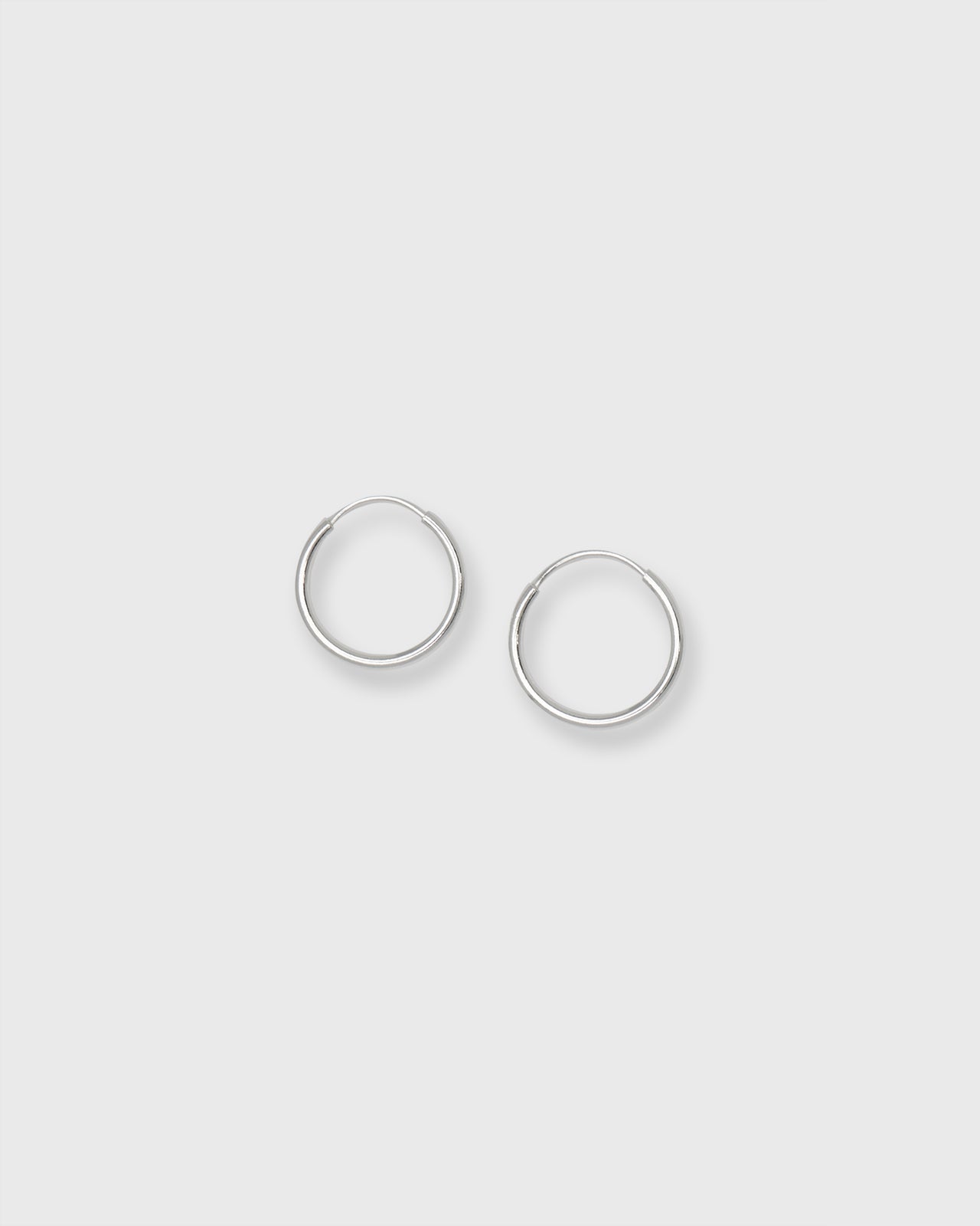 Tiny Sleeper Hoop Earrings in Silver