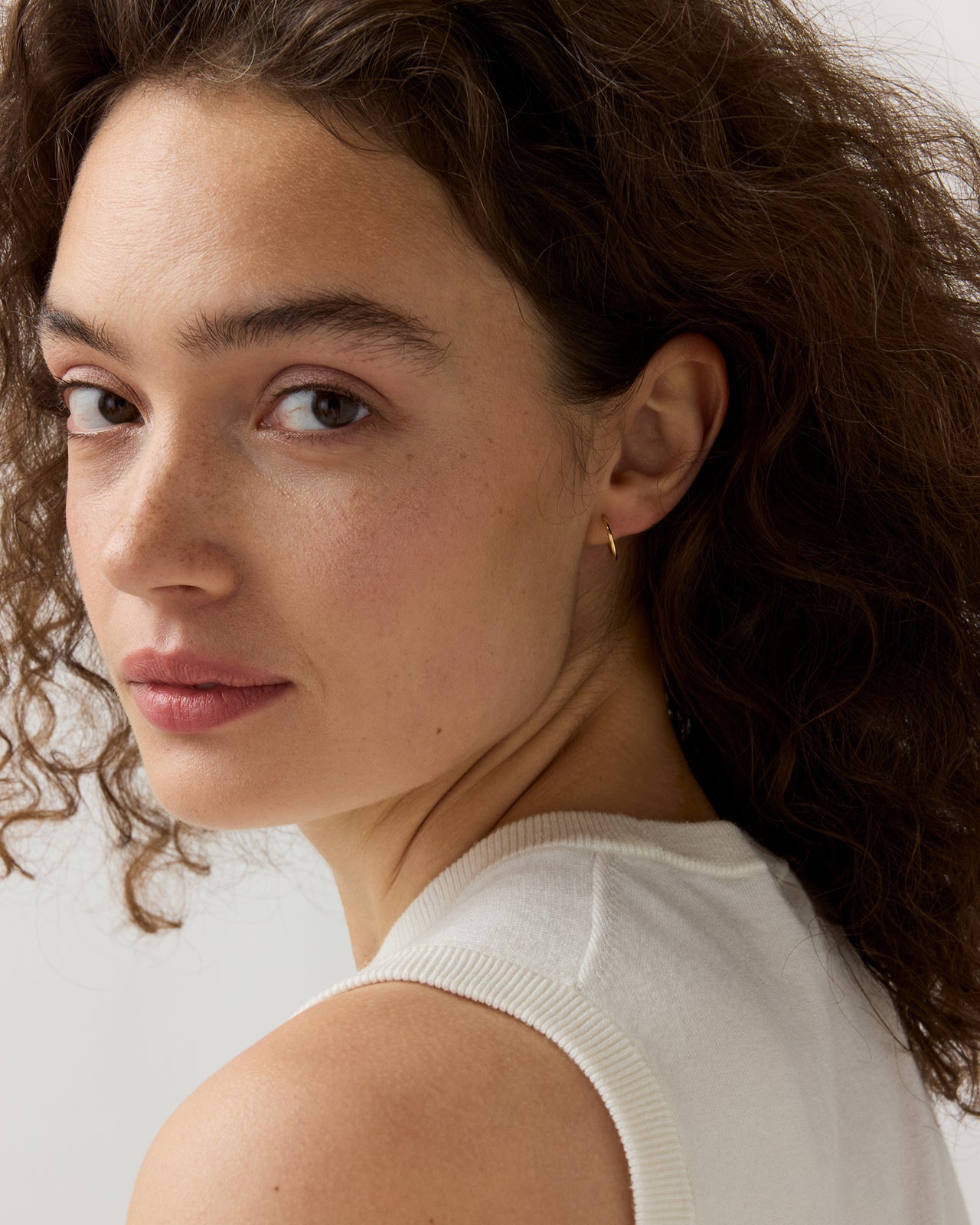 Tiny Sleeper Hoop Earrings in Gold